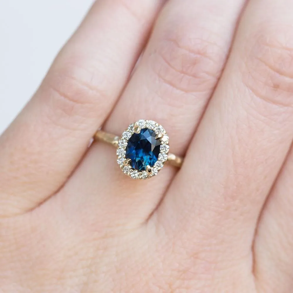 1.32ct Royal Blue Oval Sapphire Halo Ring - Evergreen Carved Band in a Satin Finish 14k Yellow Gold