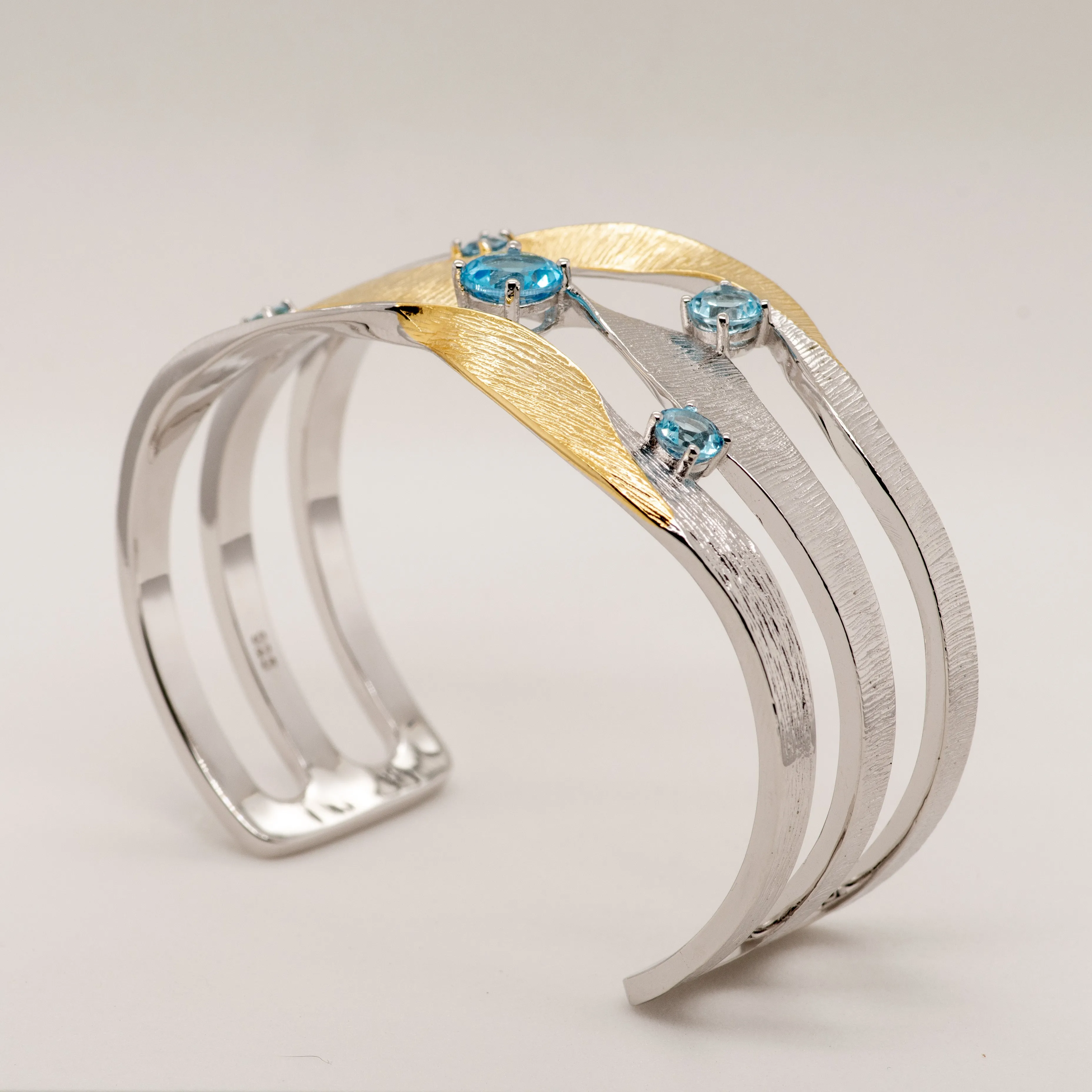 Swirl Blue Topaz Bracelet in Sterling Silver